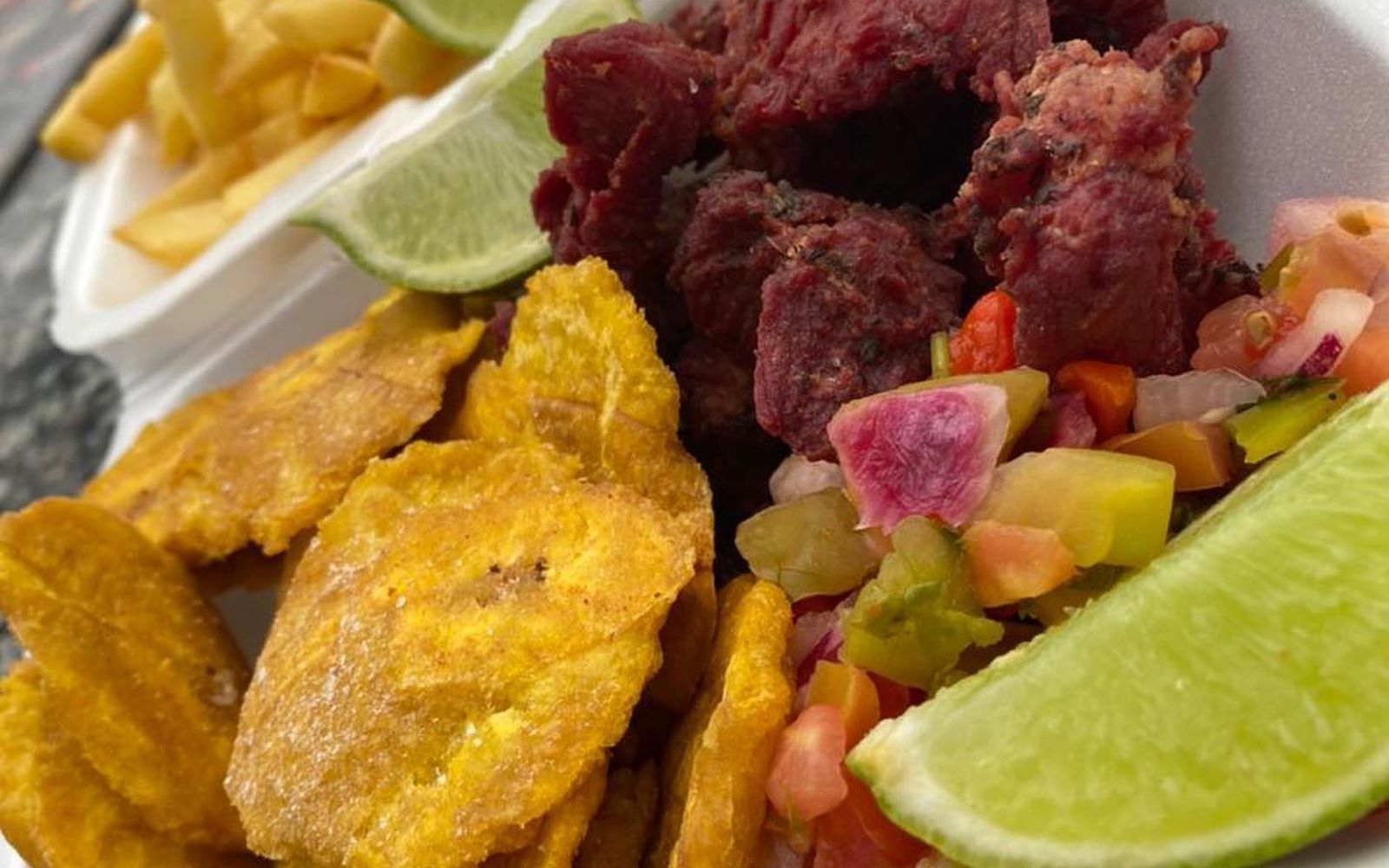 Dominican fritura platter with tostones