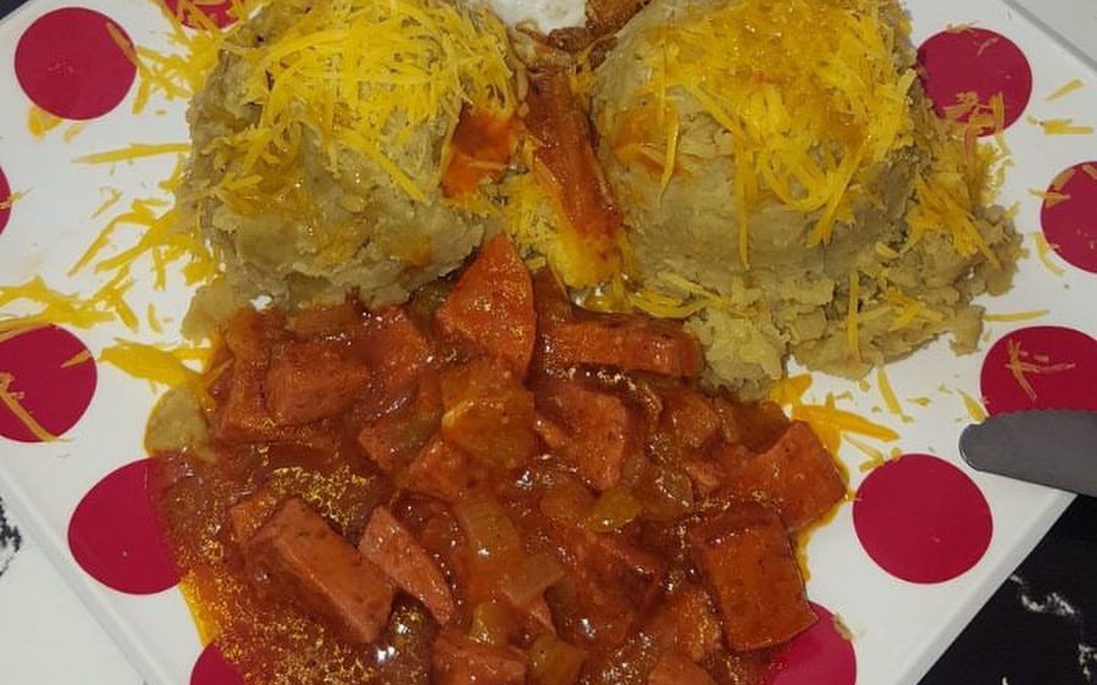 Mofongo topped with shredded cheese at Cafetería Serie 54